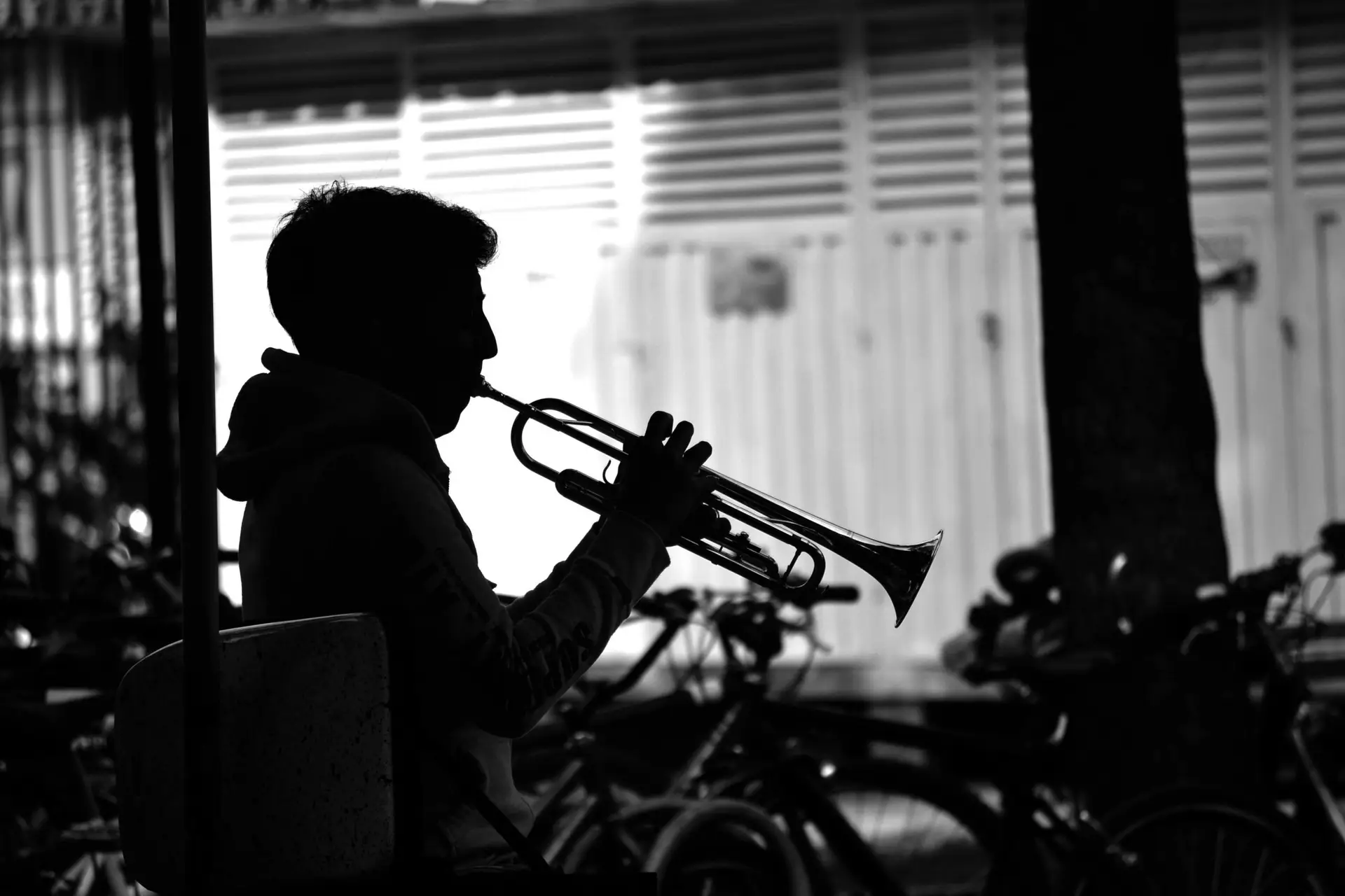 A musician playing the trumpet outdoors in Bogota, Colombia.