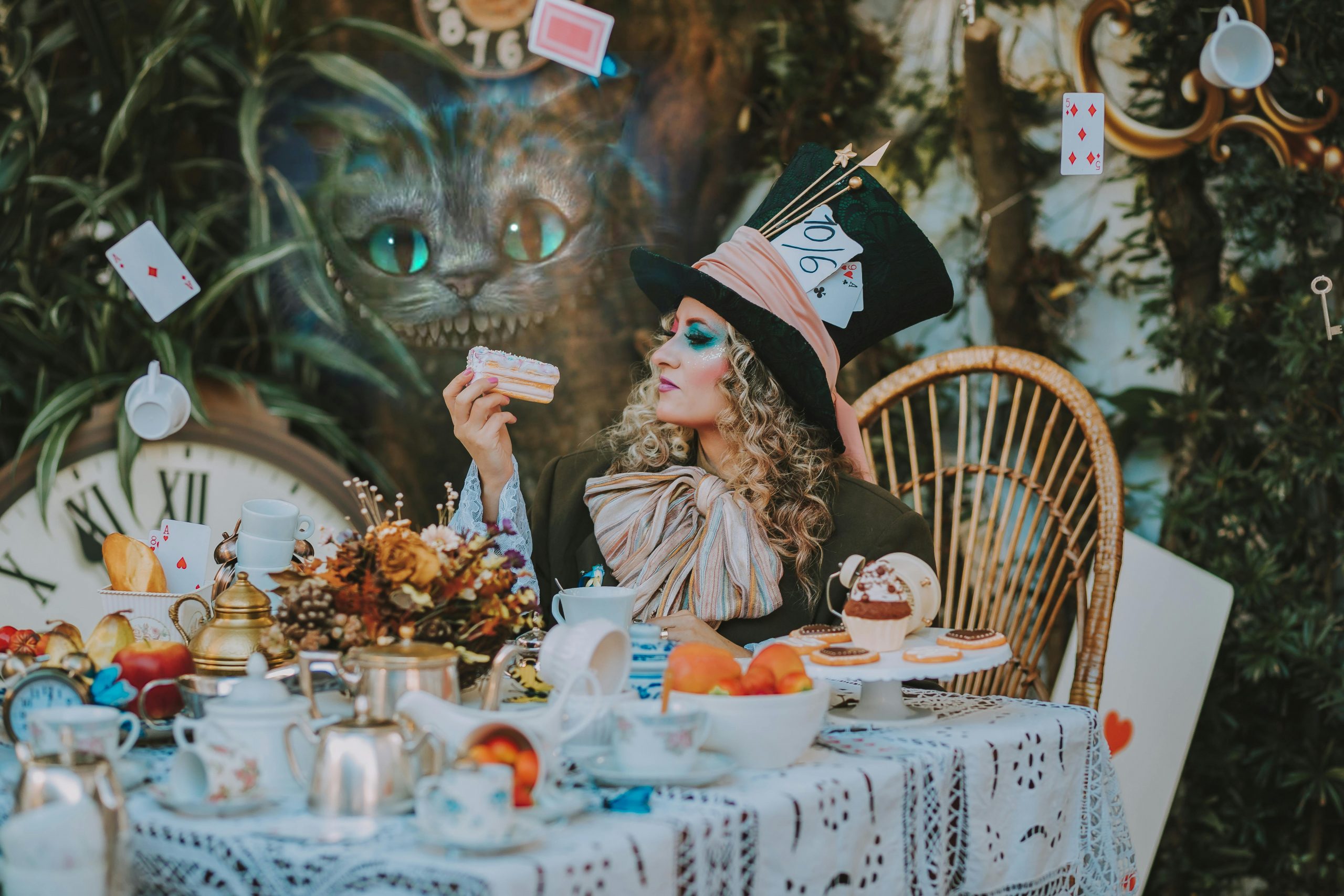 A whimsical Alice in Wonderland inspired scene with a Mad Hatter character at a tea party.