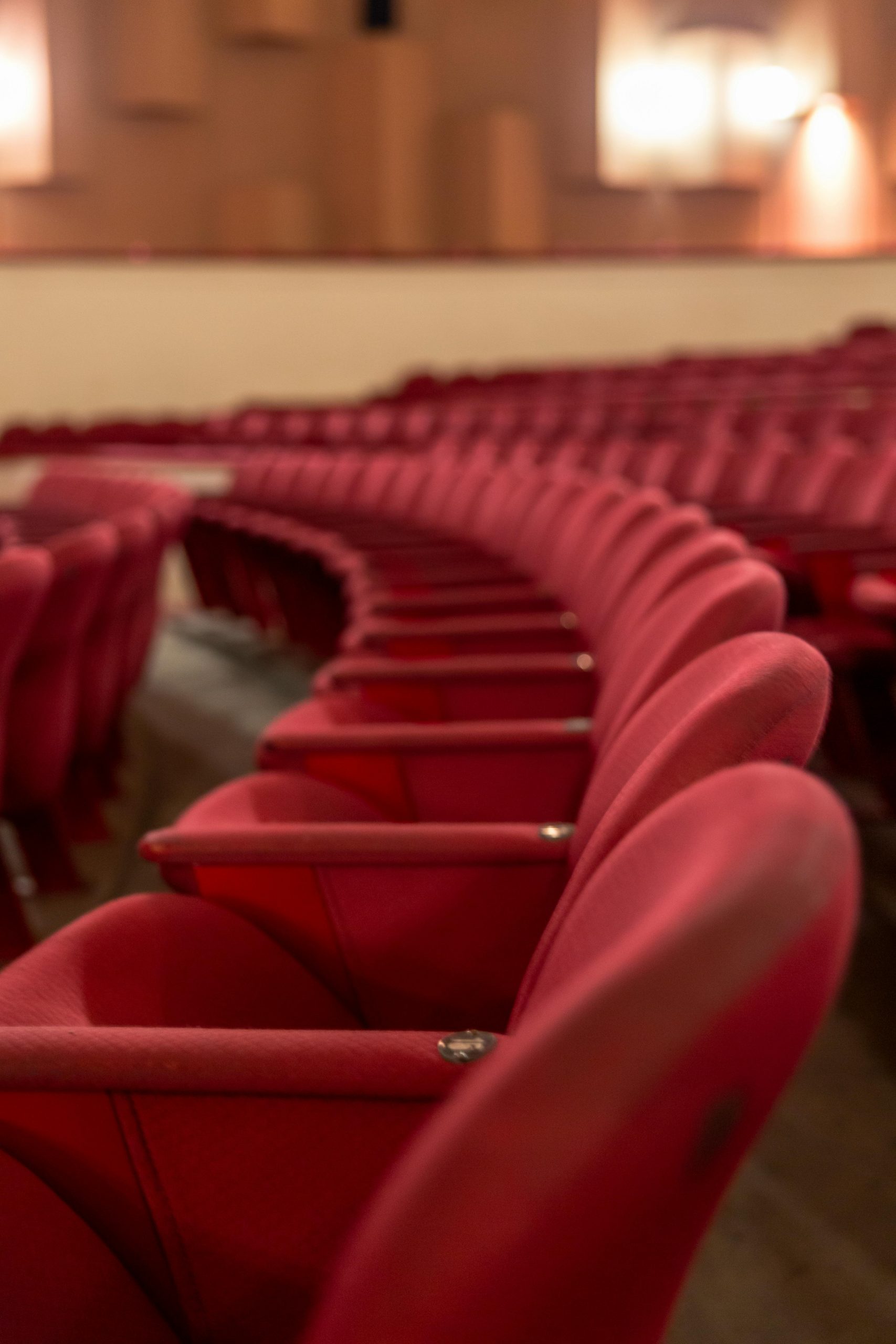 A row of red theater seats in an empty auditorium, Mar del Plata, Argentina.